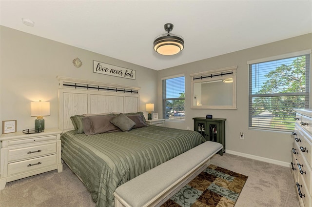 bedroom featuring light colored carpet