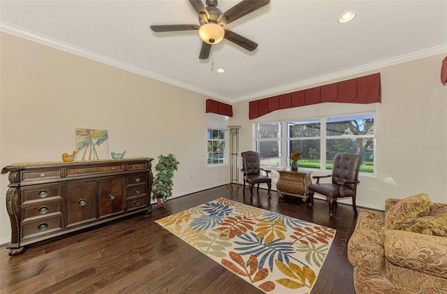 interior space featuring dark hardwood / wood-style floors, ceiling fan, and ornamental molding