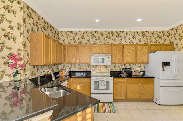 kitchen with kitchen peninsula, sink, white appliances, and ornamental molding