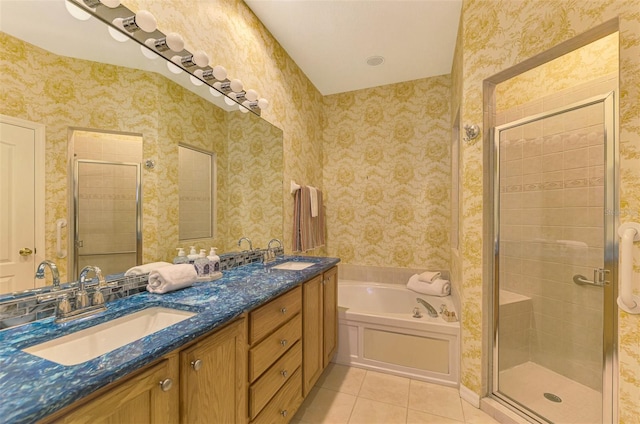 bathroom with plus walk in shower, vanity, and tile patterned floors