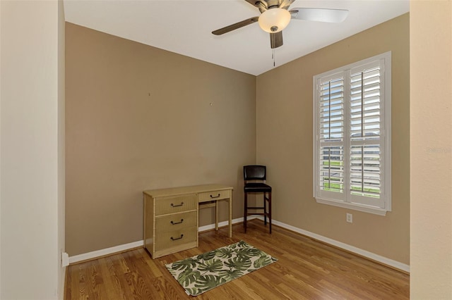 sitting room with ceiling fan and light hardwood / wood-style flooring