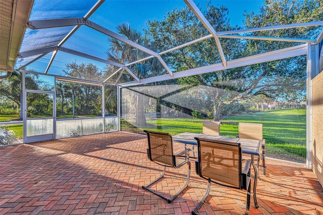 view of patio featuring a lanai