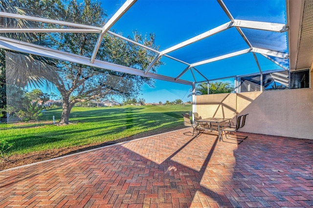 view of patio with glass enclosure