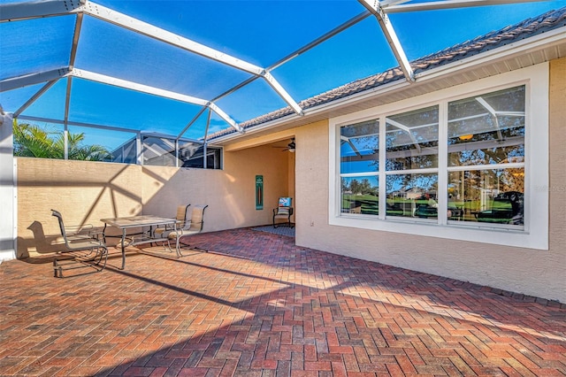 view of patio / terrace with a lanai