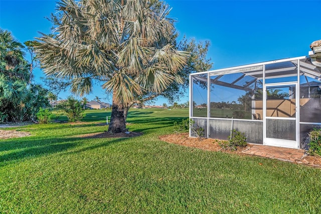 view of yard with a lanai