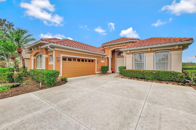 mediterranean / spanish-style house featuring a garage