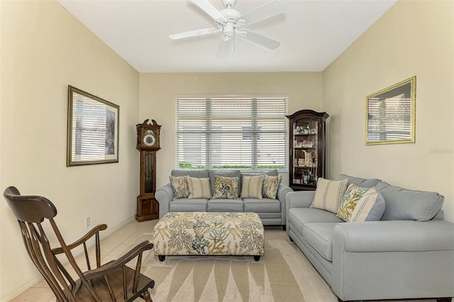 tiled living room with ceiling fan and a healthy amount of sunlight