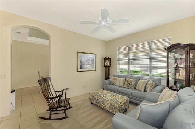 tiled living room featuring ceiling fan