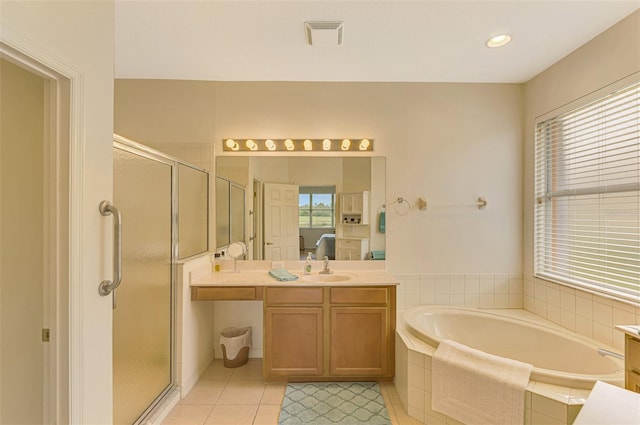 bathroom featuring plenty of natural light, vanity, shower with separate bathtub, and tile patterned flooring