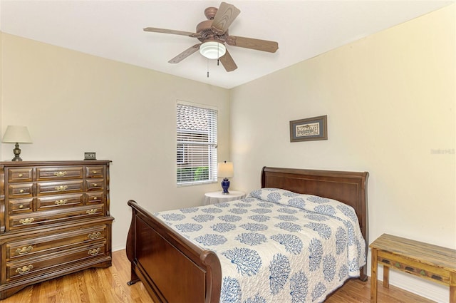 bedroom with ceiling fan and light hardwood / wood-style floors