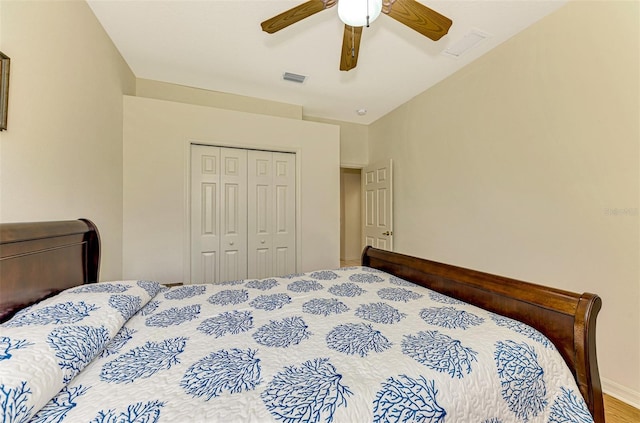 bedroom featuring wood-type flooring, a closet, and ceiling fan