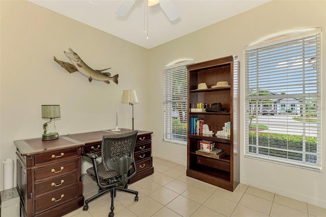 office space featuring ceiling fan, light tile patterned flooring, and a wealth of natural light