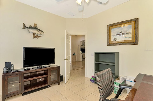 tiled office featuring ceiling fan