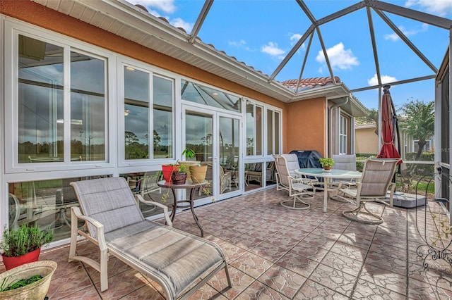 view of patio / terrace with a lanai