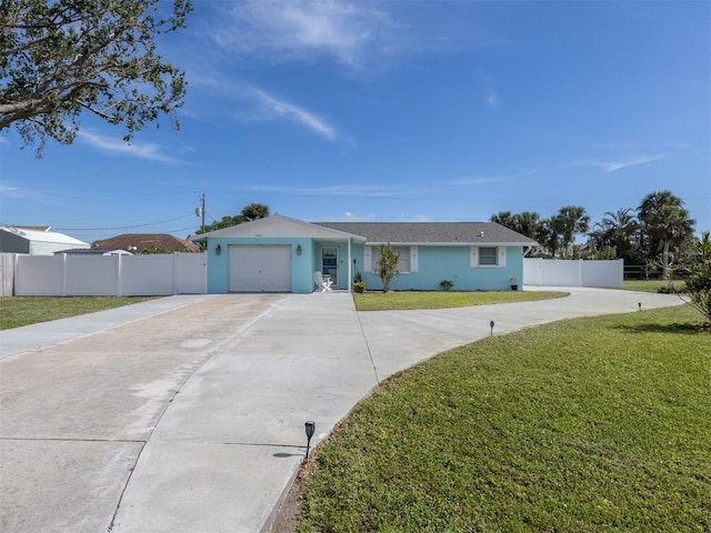 single story home featuring a garage and a front lawn