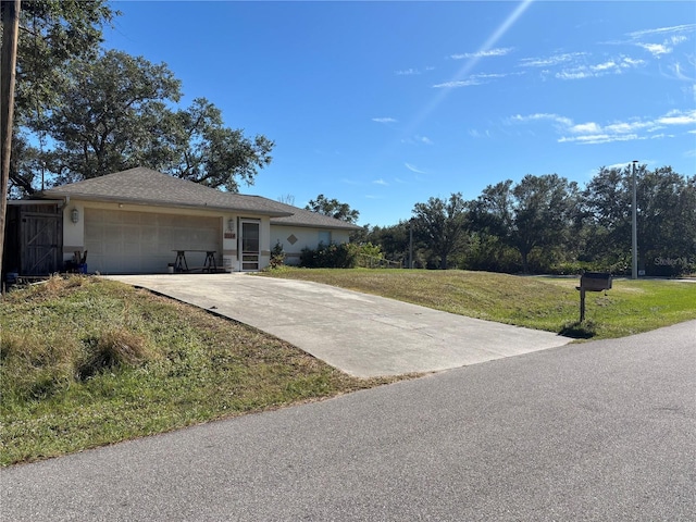 ranch-style house with a front lawn and a garage