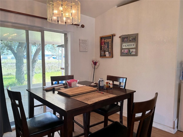 dining room featuring a chandelier and hardwood / wood-style flooring