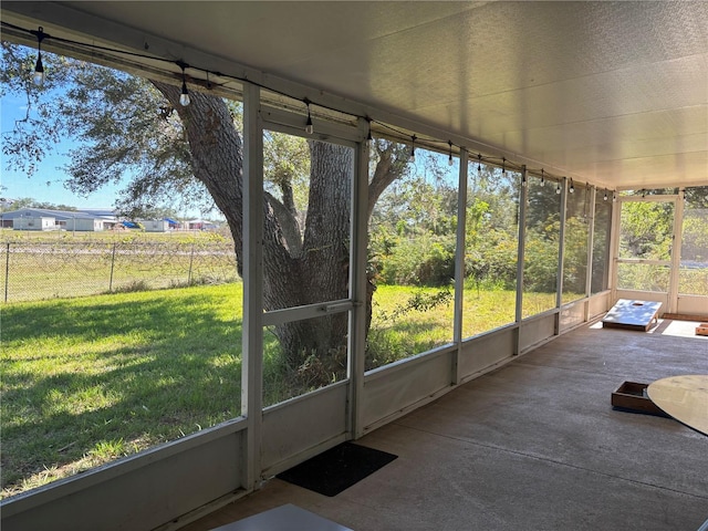 unfurnished sunroom featuring a wealth of natural light