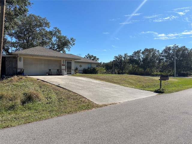 ranch-style home with a front lawn and a garage