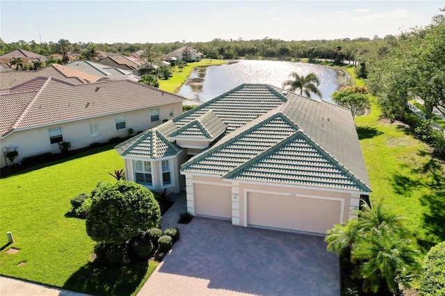 birds eye view of property with a water view