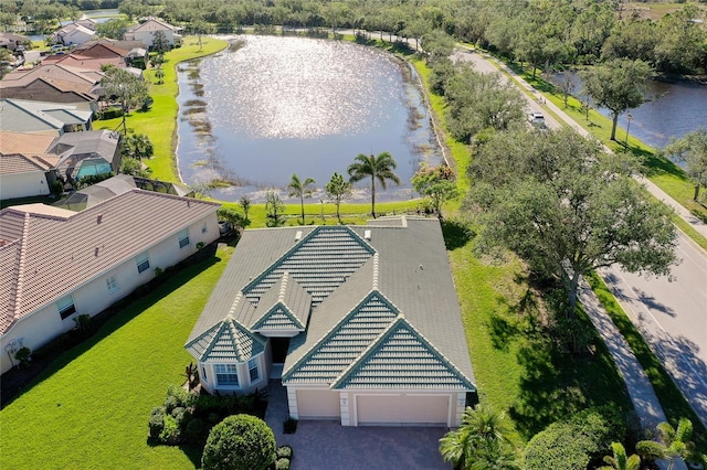 birds eye view of property with a water view