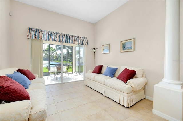 tiled living room featuring decorative columns