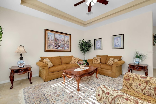 tiled living room with ceiling fan