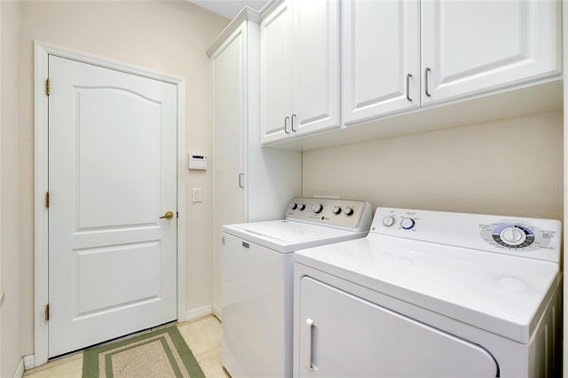 laundry room with cabinets and independent washer and dryer