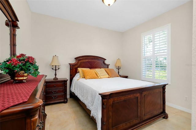 bedroom with light tile patterned floors