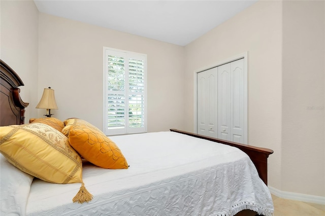 carpeted bedroom with a closet