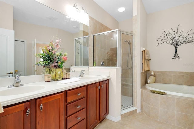 bathroom with tile patterned flooring, shower with separate bathtub, and vanity