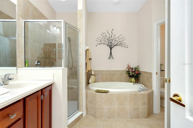 full bathroom with tile patterned flooring, vanity, shower with separate bathtub, and toilet