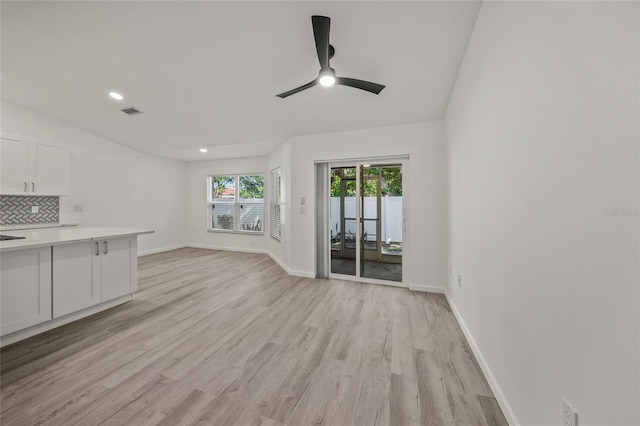 unfurnished living room featuring ceiling fan and light hardwood / wood-style floors