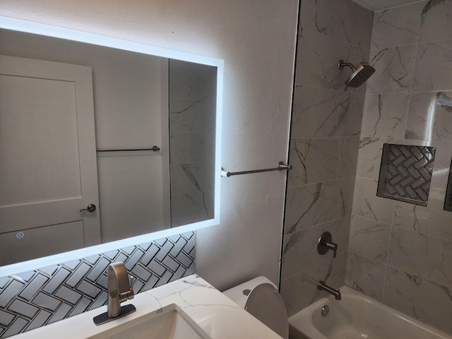 full bathroom with tiled shower / bath combo, tasteful backsplash, vanity, and toilet