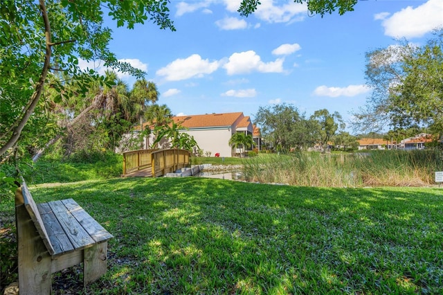 view of yard featuring a wooden deck