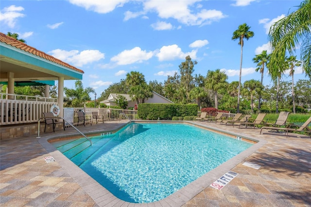 view of swimming pool with a patio area