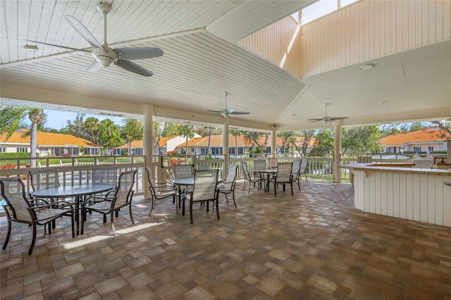 view of patio / terrace featuring a water view and ceiling fan