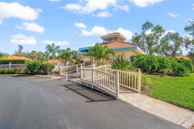 606 Marcus St Unit 26, Venice, FL 34285 - view of front facade featuring a tile roof and stucco siding