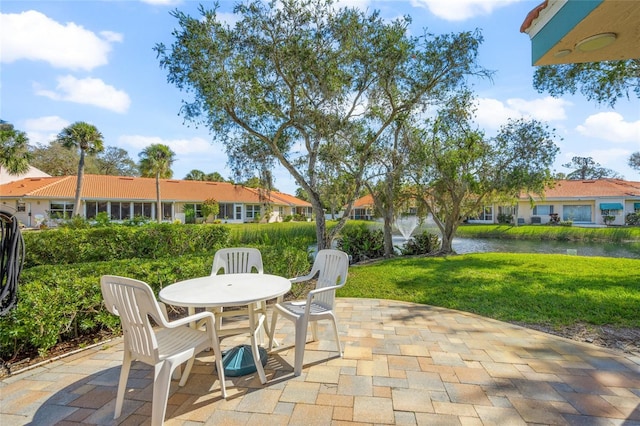 view of patio with a water view