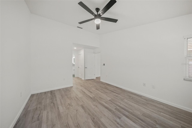 empty room with ceiling fan and light wood-type flooring