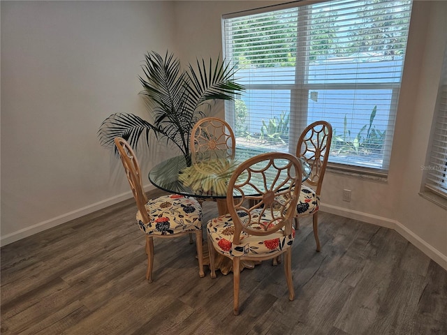 606 Marcus St Unit 26, Venice, FL 34285 - dining space featuring dark wood-style floors and baseboards
