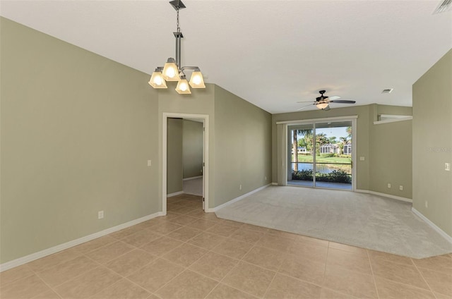 empty room with light colored carpet and ceiling fan with notable chandelier