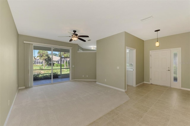 carpeted empty room featuring ceiling fan