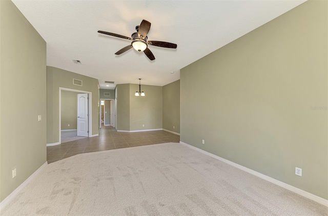 unfurnished room featuring light carpet and ceiling fan