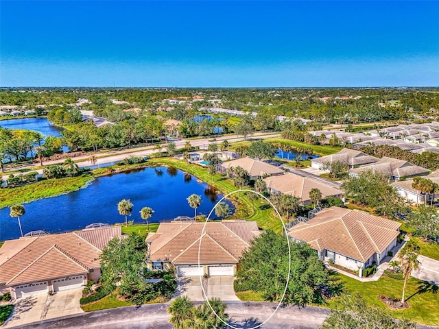 birds eye view of property with a water view