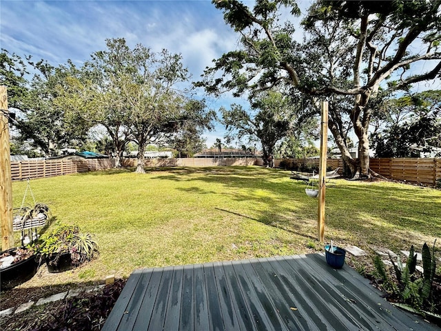 view of yard featuring a wooden deck