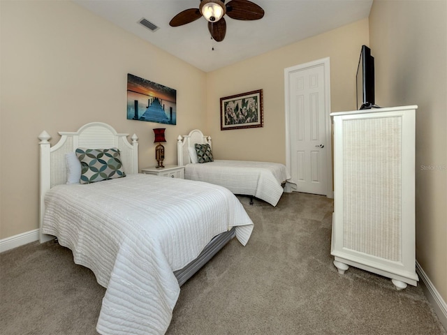 bedroom featuring ceiling fan and light colored carpet