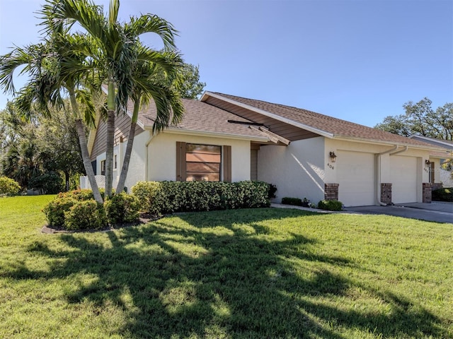 single story home featuring a front yard and a garage