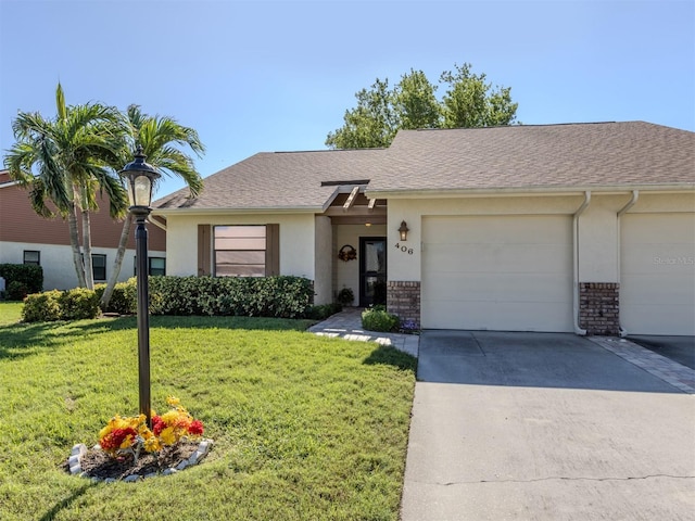 ranch-style home with a front yard and a garage