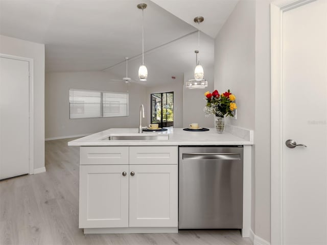 kitchen featuring lofted ceiling, sink, stainless steel dishwasher, light wood-type flooring, and white cabinetry